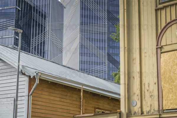 Modern office buildings, high-rise buildings, small old building, wooden house, Maakri-Kvartal
