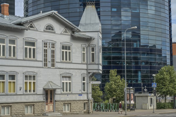Modern office building, high-rise building, small old building, wooden house, Maakri-Kvartal