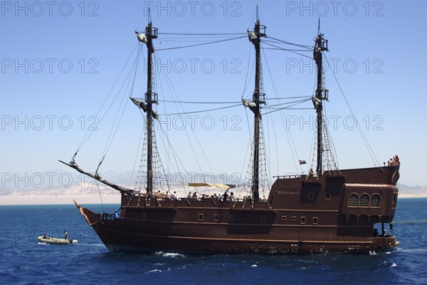 The luxury pirate yacht Black Pearl, with a group of tourists on board, enjoys a cruise through the