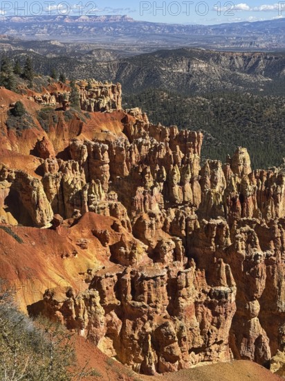 Impressive red rock landscape with sweeping views over layered, smoky rocks, Bryce Canyon National