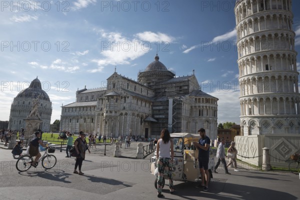 PISA, ITALY - JUNE 15, 2016: Pedestrians near the Pisa Leaning tower, in Square of Miracles (Piazza