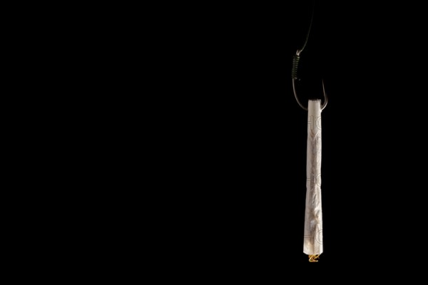 Marijuana joint baiting a fishing hook, representing addiction, dependence, and the lure of drug