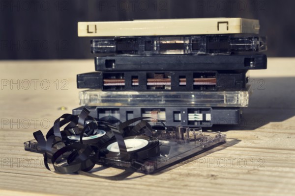 Old broken unwound compact cassette audio tape messed up