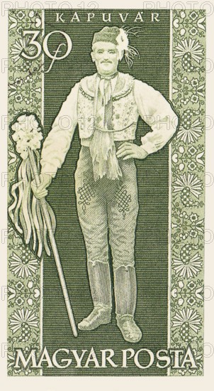 An old vintage Hungarian postage stamp depicting a man in traditional clothing from the town of