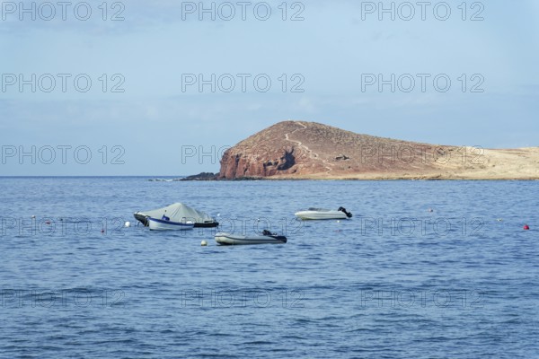 Dramatic cliffs around Montana Bocinegro and Montana Roja mountain, Tenerife coast near El Medano,