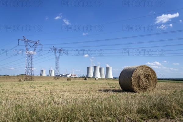 Cooling towers at nuclear power plant, energy self-sufficiency, greenhouse emission reduction and