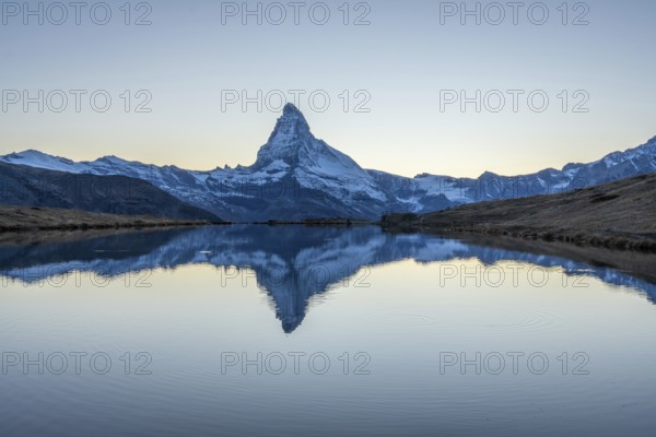 Matterhorn Mountain and Reflection in Lake Stellisee in Evening Twilight. Swiss Alps. Valais,