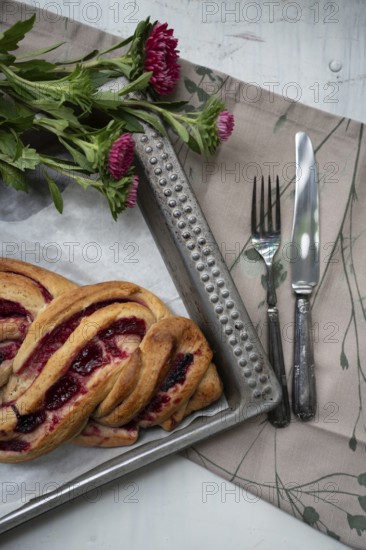 Marmalade strudel on an antique baking tray