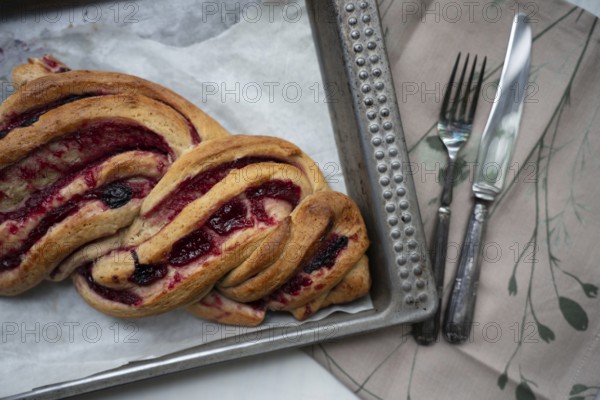 Marmalade strudel on an antique baking tray