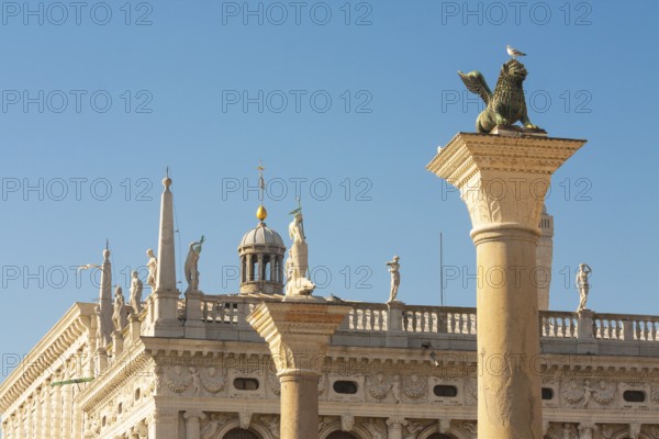 Columns of San Marco and Saint Theodor and detail of library Marchiala on San Marco square, Venice,