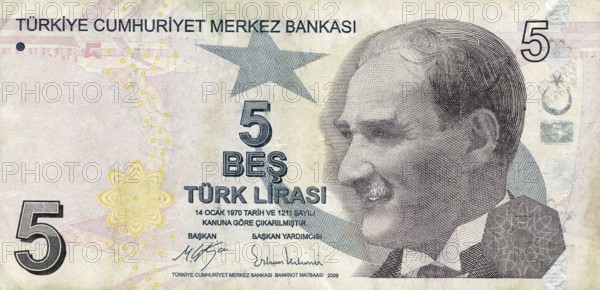 A paper banknote of 5 lira denomination issued by the Central Bank of Turkey for financial and