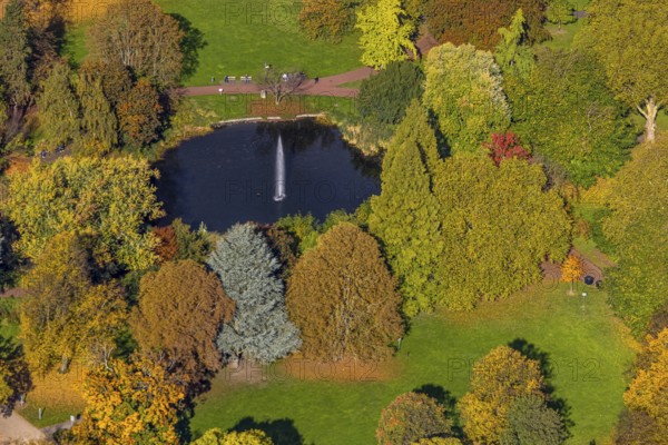 Aerial view, fountain and lake in city garden with autumn trees, Südviertel, Essen, Ruhr region,