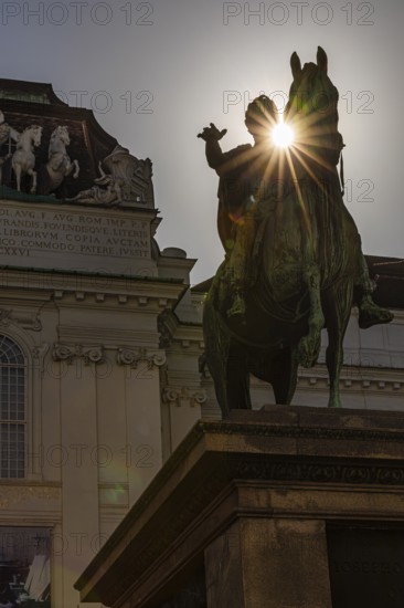 Sunbeams over the equestrian statue of Emperor Joseph II, Josefsplatz, Vienna, Austria