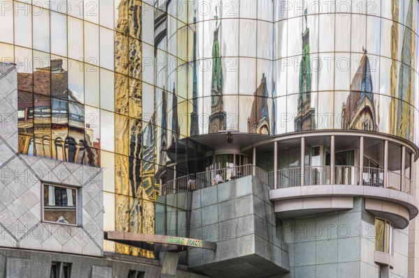 Historic buildings are reflected in the glass façade of the Haas House, Stephansplatz, Vienna,