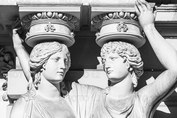 Women as supporting marble statues at a historic building, black and white photo, Josefsplatz,
