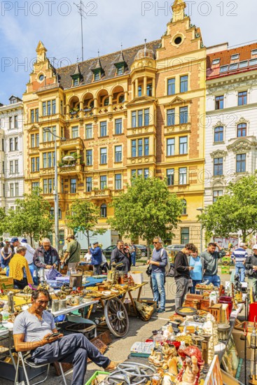 Antique and flea market, on the Chain Bridge south of the Naschmarkt, behind the historic facades