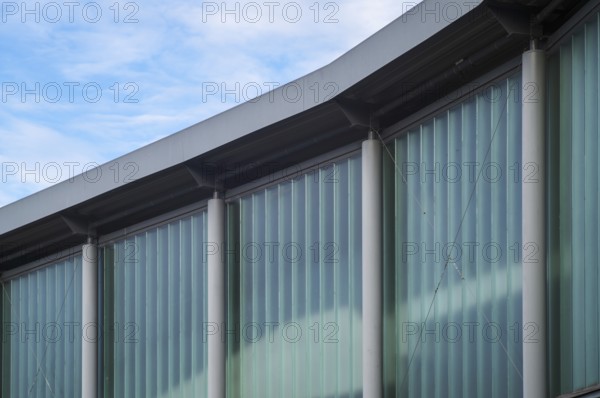 Borken, NRW, Germany, RModern building facade details showing translucent glass walls and concrete