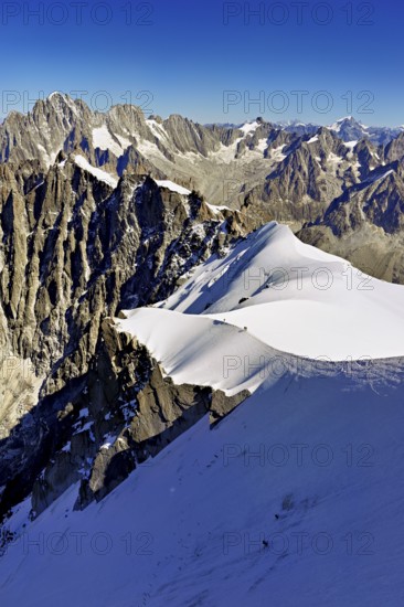 View from the Aiguille du Midi mountain station observation deck of the mountains Aiguille Vert,