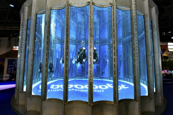 Diving tower with divers, logo lettering boot Düsseldorf on the ground in exhibition hall 12 of