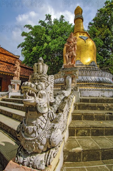 Golden stupa Buddhist element building symbol for Buddha and his teaching Dharma, in the foreground