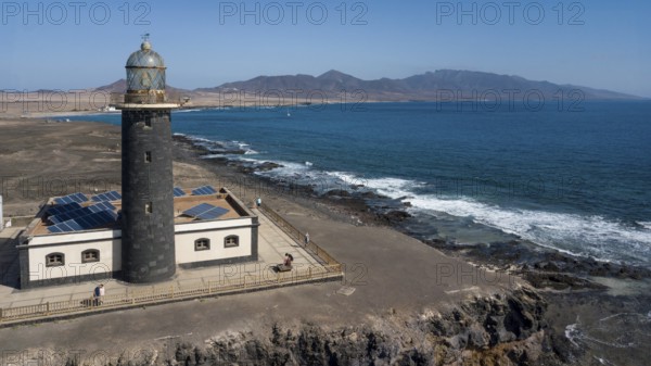 Aerial view of Faro Punta de Jandia lighthouse on a rocky outcrop at the southern tip of Jandia