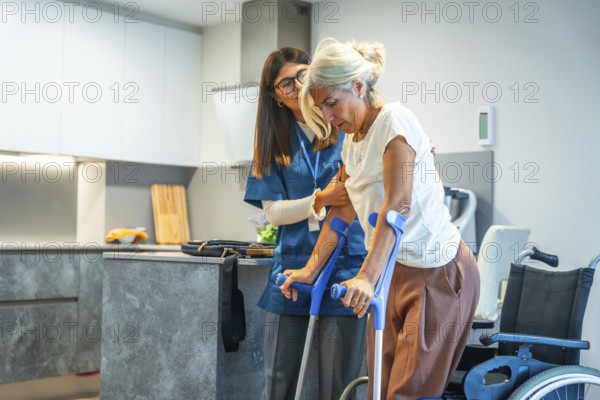 Young female caregiver is providing support and assistance to a senior woman, helping her during a