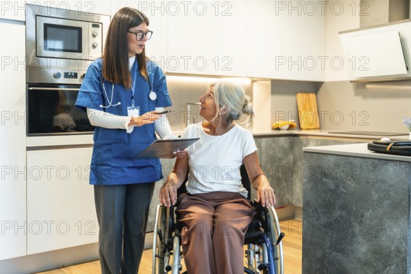 Professional nurse in uniform explaining medical information to an elderly woman sitting in a