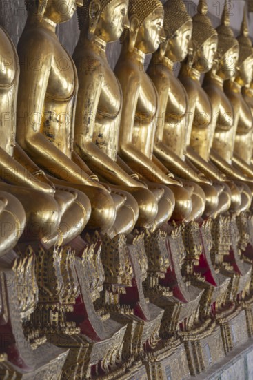 Gilded Buddha statues (Bhumispara mudra: Buddha Gautama at the moment of enlightenment), Wat Suthat