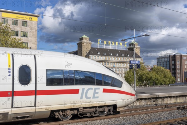 ICE train on track 2 in Essen main station, view of the city center, Handelshof building with Essen