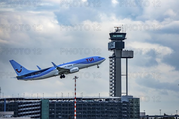 TUI Fly Boeing 737-800 taking off from Düsseldorf Airport, Air Traffic Control Tower, North