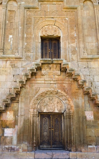 Elaborately designed façade with stairs and ornately decorated doors, Noravank monastery, Surb