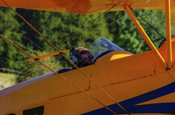 A biplane Bücker Bü 131 Jungmann with registration SP-YPZ during a flight demonstration as part of