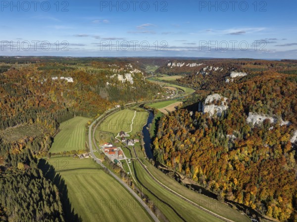 Aerial view of Upper Danube Valley surrounded by autumn vegetation, on the horizon Werenwag Castle,
