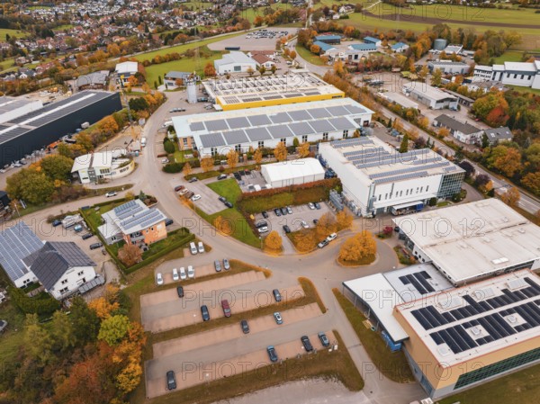 Industrial area with large buildings and parking spaces in an autumn environment, Dornstetten,