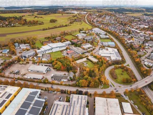 Aerial view of a city with industrial buildings, roads and autumn landscape, Dornstetten,