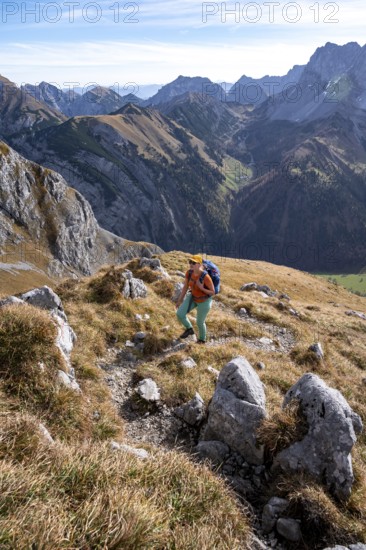 Female hiker on hiking trail, hiking to Gamsjoch, down the Ahornboden valley, eastern Karwendel,