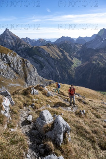 Two hikers on hiking trail, hiking to Gamsjoch, down the Ahornboden valley, eastern Karwendel,