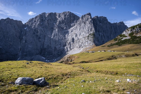 Dreizinkenspitze and Laliederer Wand, large rock face with meadows in the foreground under blue