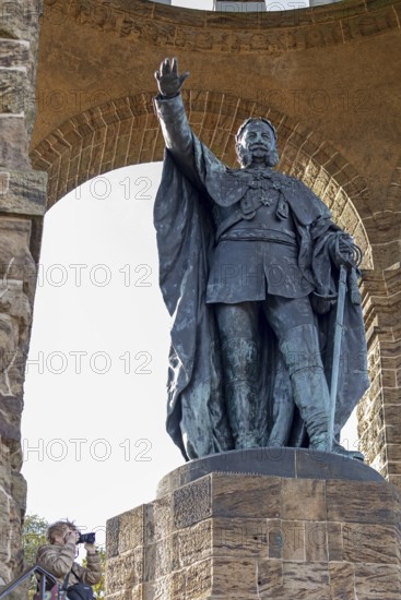Woman photographed, statue, Kaiser Wilhelm Memorial, Porta Westfalica, North Rhine-Westphalia,