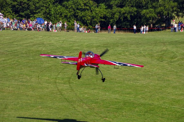 A Soviet Jakovlev Jak-55 sport aircraft with the registration LY-TOY during a flight demonstration