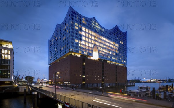 Elbe Philharmonic Hall at the Blue Hour with light strips of vehicles in the foreground and light