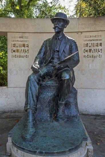 Statue of Emile Claus, Emiel Claus, Belgian Luminist painter in the Citadelpark of the city Ghent,