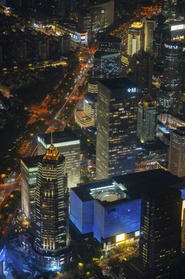 Aerial view over illuminated skyscrapers in Lujiazui financial district from Shanghai Tower