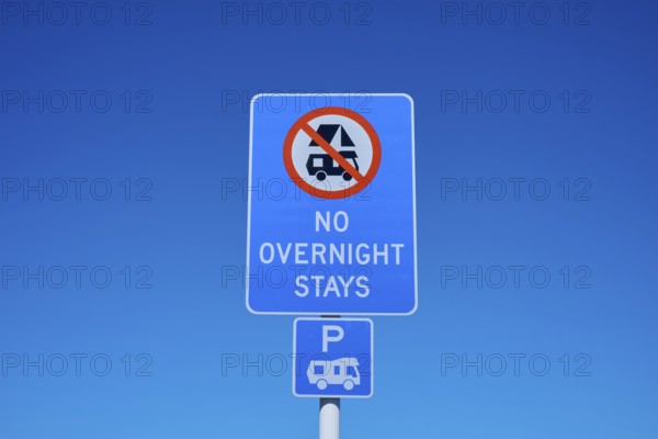 Road sign banning camping under clear blue sky, Lake Pukaki Viewpoint, Pukaki, Canterbury, South