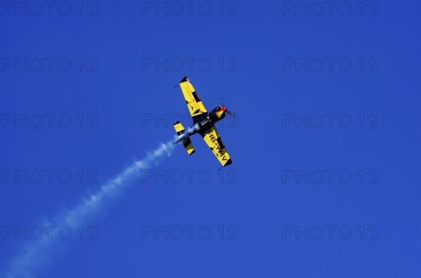 A Votec 351 sport aircraft from the Swiss MSW Aviation AG with registration HB-YMV during a flight