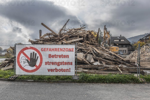 Large construction site banner, entry into danger zone strictly prohibited! Demolition of a