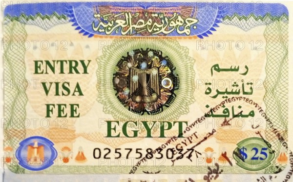 Tourist visa with stamp for entry to mainland Egypt, pasted into the passport at the airport of