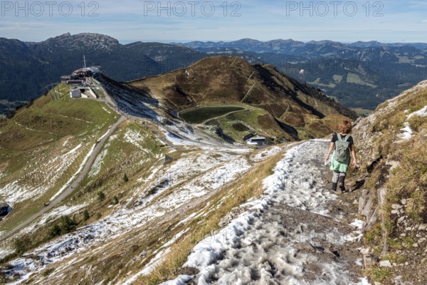 Female hiker on hiking trail below the Kanzelwand, back left Kanzelwandbahn mountain station,