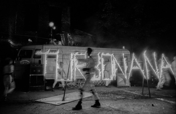 Germany, Berlin, 1.8.1992, fire artist, performing in the courtyard of the occupied building at