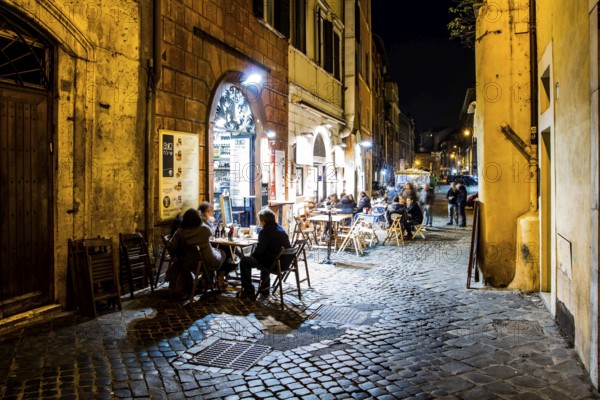 Street with bars and restaurants in Roman Ghetto (Ghetto di Roma). Rome, Province of Rome, Italy.